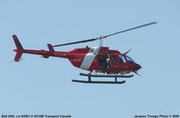 C-GCHM @ YQB - See the guy aboard taking pictures of the banks of the River - by Jacques Trempe