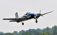 N977T @ 5W8 - Departing runway 22 - by John W. Thomas