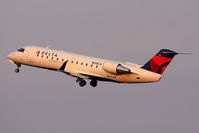 N818CA @ ORF - Delta Connection (Comair) N818CA (FLT COM588) climbing out from RWY 5 enroute to New York John F Kennedy Int'l (KJFK). Seen here in new Delta colors.