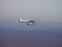 N8667U - N8667U in flight - by M.C. Ritter