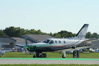 N700YN @ KOSH - Socata TBM 700 - by Mark Pasqualino