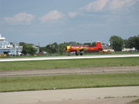 N63727 @ OSH - 1977 Nanchang China CJ-6A as NX63727 'NOTAYAK', Huosai 6A 9 cylinder radial 285 Hp, landing roll Rwy 36 - by Doug Robertson