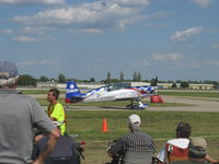 N771TA @ OSH - 2006 Extra Flugzeugbau Gmbh EA 300L, Lycoming AEIO-540-L1B5 300 Hp, taxi - by Doug Robertson
