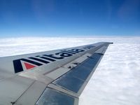 I-DANW - MD 82 wing LHR to LIN - by Chris Nettleton
