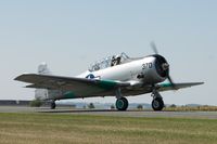 N7090C @ KFCM - Taxiing for takeoff at AirExpo 2008, Flying Cloud Airport, Eden Prairie, MN