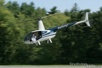 N411TC @ 26MA - R-44 departs with a wingsuit-equipped skydiver in the door. - by Dave G