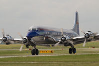 N996DM @ VIE - Red Bull DC6 - by Yakfreak - VAP
