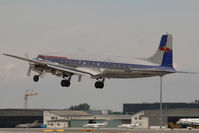 N996DM @ VIE - Red Bull DC6 - by Yakfreak - VAP