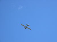 C-GBKG @ CYXE - Cessna C-GBKG flying over my house while practicing maneuvers in the area. - by Ky Weichel