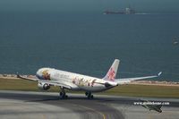 B-18311 @ VHHH - China Airlines touching down on runway 25R - by Michel Teiten ( www.mablehome.com )