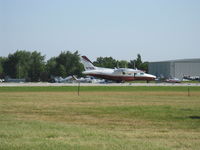 N7601L @ OSH - Mitsubishi MU-2B-36A, two Garrett Airesearch TPE331-25A Turboprops 575 shp each, takeoff roll Rwy 09 - by Doug Robertson