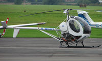 G-BOXT @ EGBJ - Hughes 269C noted at Gloucestershire Airport  UK in Sept 2008 - by Terry Fletcher