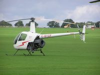 G-BYCF @ EGBK - R22 at Sywell - by Simon Palmer