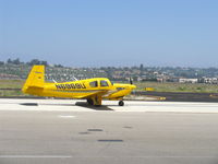 N6969U @ CMA - 1964 Mooney M20E SUPER 21, Lycoming O&VO-360 200 Hp, taxi - by Doug Robertson