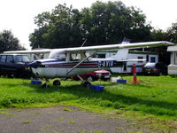 G-AVIA @ EGSP - in the graveyard behind the main hangar at Sibson - by chris hall