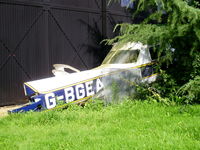 G-BGEA @ EGSP - in the graveyard behind the main hangar at Sibson - by Chris Hall