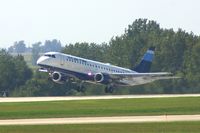 N239JB @ CID - The press plane departs runway 9