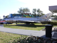 0210 @ EHKD - Mig21 Fishbed on a bed of wood near the tower - by Alex Smit