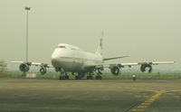 UNKNOWN @ WIII - Really quiet 747 (no engines) on Garuda maintenance ramp at Jakarta - by John J. Boling
