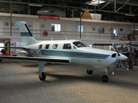 N825WS @ EHKD - Nice bizzer tucked away in the GA hangar - by Alex Smit
