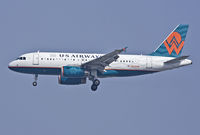 N838AW @ KLAX - Hybrid title/livery on short final rwy 24R at KLAX - by Philippe Bleus