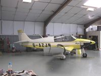 G-AZJN @ EGST - Robin in maintenance hangar at Elmsett