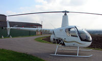 G-BRWD - a1989 Robinson R22 at a quiet Cambridgeshire  airfield - by Terry Fletcher