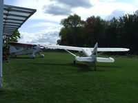 N21117 - Two Stinsons parked and waiting - by Terry L. Swann