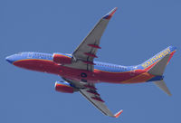 N244WN @ KSNA - Southwest B737-7H4 lifting off on a gorgeous day. - by Mike Khansa
