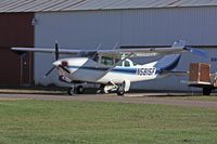 N5815F @ ANE - It's unusual to see the main landing gear doors hanging down on a Cessna 210, serial 21058815 - by Timothy Aanerud