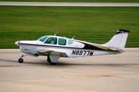 N8977M @ CID - Taxiing to Runway 27 for departure.