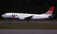 JA8526 @ KBFI - Scanned from a slide - by Nick Dean