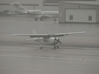 N830SP @ SMO - N830SP arriving on RWY 03 during a heavy downpour - by Torsten Hoff