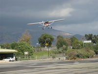 N714HH @ SZP - 1977 Cessna 150M, Continental O-200 100 Hp, really big slip angle vis-a-vis Rwy 22. Note: No stall/spin, pretty good crosswind landing from this slip. I found myself in harm's way between the runway and the aircraft heading for this shot! - by Doug Robertson