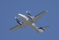 N49WC @ KSNA - Beech B300 climbing up on a gorgeous day. - by Mike Khansa