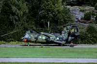 04068 @ ESGP - Due to its camouflage this HKP 4 is hardly visible against the back ground. Even the upper side of the rotor blades have a camouflage pattern. - by Joop de Groot