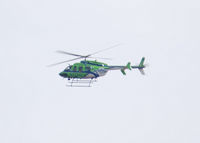 N773AL - Airlife of Denver Flying North over Columbine High School, Littleton Colorado - by Bluedharma