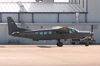 N21420 @ FTW - At Meacham Field - Future Iraqi Air Force Caravan - Notice Hellfire missle on the wing hard point. - by Zane Adams