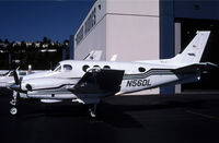 N56DL @ KBFI - This King Air is just to the left of a partially open hangar