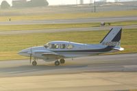 N40597 @ CID - Taxiing to Runway 31 for departure.  Looking into the sun - by Glenn E. Chatfield