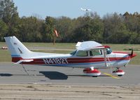 N4182T @ DTN - Parked at Downtown Shreveport with a E-8 JSTARS (B707) coming in to Barksdale Air Force Base in the background. - by ppick