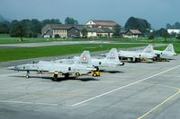 J-3052 @ LSMF - During the annual refresher course these Tigers are waiting for yet another mission. In the background the usual net barrier. It was not until the arrival of the Hornet that Switzerland introduced arrester cables. - by Joop de Groot