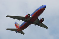 N324SW @ IAD - Boeing 737-3H4 N324SW takes off from Dulles - by Chris England