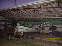 N86023 - Settin in butch's hanger waiting to be worked on - by Ken Kinsler
