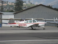 N5828S @ SZP - 1964 Beech S35 BONANZA, Continental IO-520-B 285 Hp, taxi - by Doug Robertson