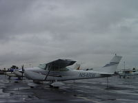 N54RW @ POC - Parked in the rain a Brackett - by Helicopterfriend