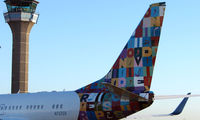 N737ER @ EGGW - This Executive Boeing 737 has each side of its tail , painted in different liveries  - Side 1 of 2 - by Terry Fletcher