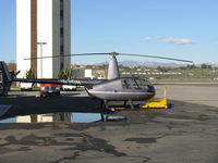 N590H @ CMA - 2008 Robinson R44 RAVEN II, Lycoming IO-540-AE1A5 245 Hp for 5 minutes derated to 205 Hp continuous, at Orbic's ramp. CMA's Air Traffic Control Tower behind. - by Doug Robertson
