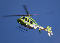 N374AL - AirLife Denver heading West over Columbine High School Littleton, Colorado. - by Bluedharma