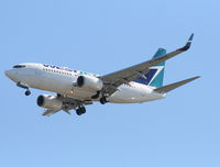 C-FWAQ @ TPA - West Jet 737-700 - by Florida Metal
